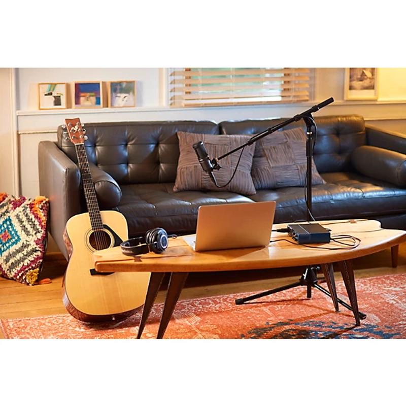 Audio-Technica AT2020 condenser microphone in home studio setting